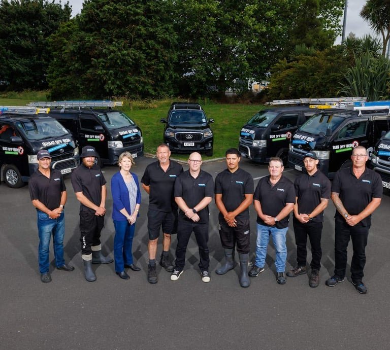 The Grime Off team with their fleet of work vehicles